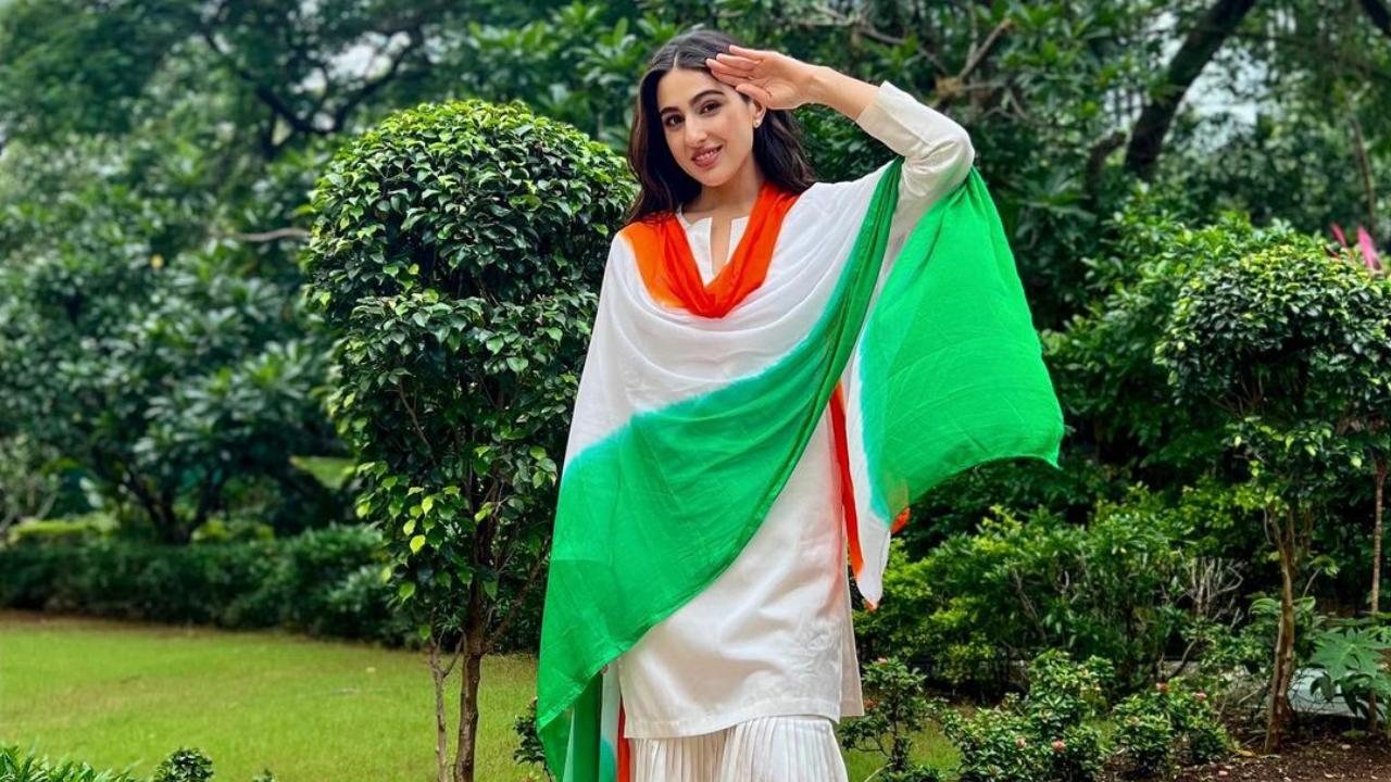 Sara Ali Khan, dressed in a white suit and tri-coloured dupatta gives a salute, wishing all on I-Day