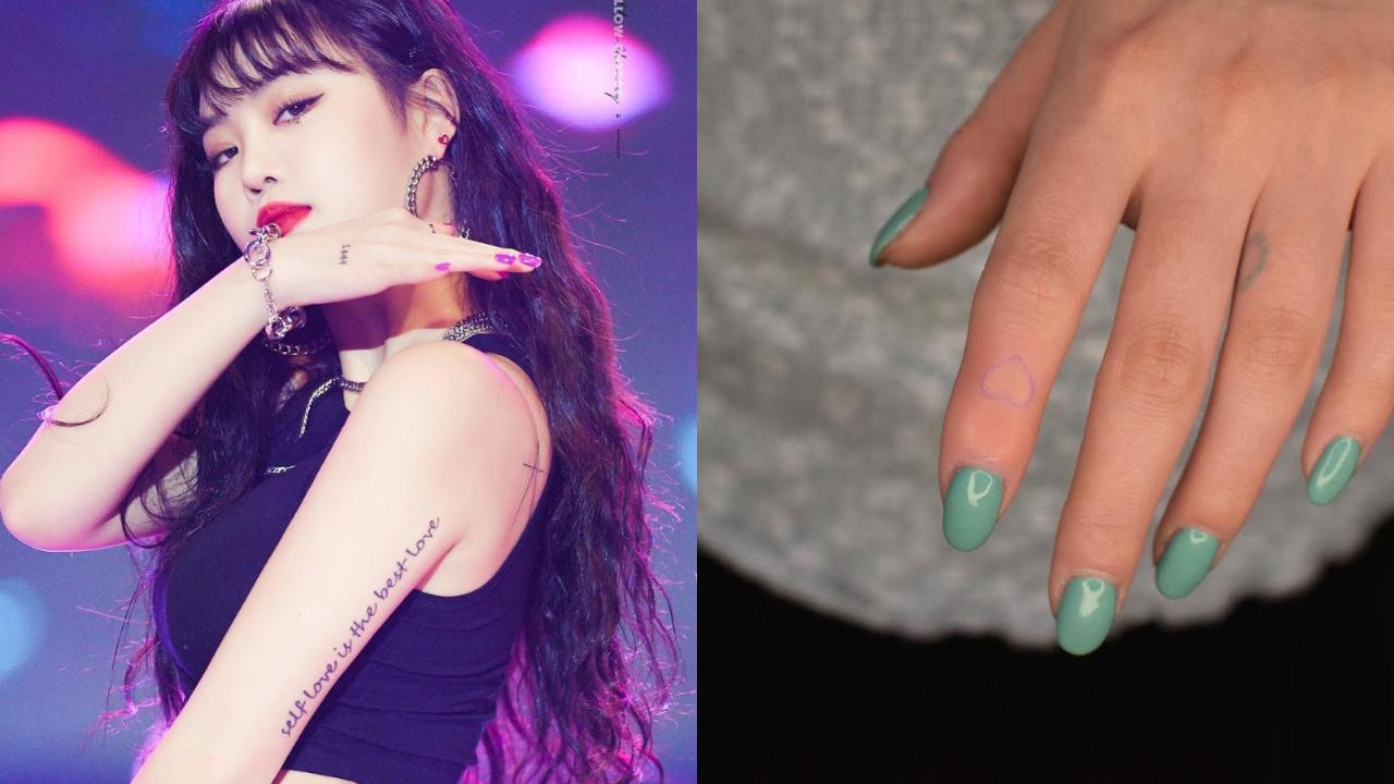 Soojin (former (G)I-DLE)
Soojin appears to have the most tattoos out of all fourth generation K-Pop idols! All of them are on the smaller side, and their daintiness makes the inked designs look prettier. One of them includes a small line heart on her finger