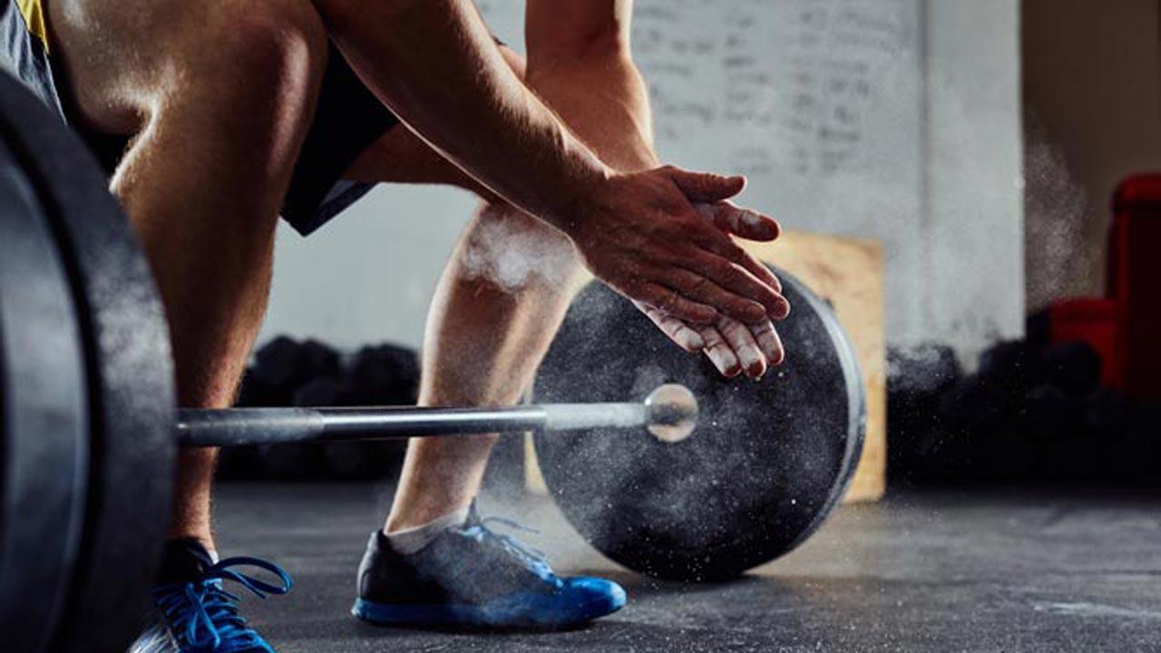 Iran bans weightlifter Rajaei for handshake with Israeli opponent