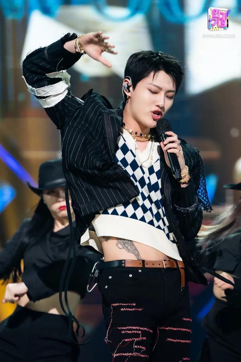 WOODZ
WOODZ has a formidable gun inked across his abdomen that his often visible during his performances. It is positioned as though it were in a holster. WOODZ revealed that it was inspired by Hollywood heroes who always carried a hidden gun. The tattoo was a tribute to his early struggling days in the Korean entertainment industry - a metaphor for his abilities and talents that could be unleashed at any time as a 'secret weapon.' The artist said that the tattoo has been really painful to get - and took nearly 12 hours!
 