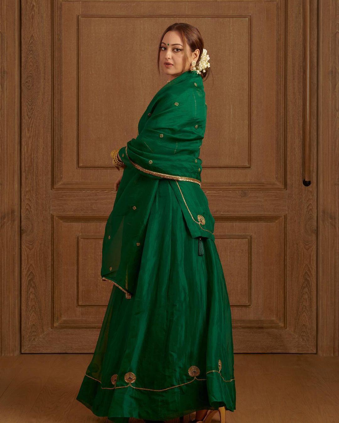 Sonakshi Sinha looked stunning in an all-green ensemble. The actress donned a short kurta paired with a matching skirt and complemented it with a dupatta featuring a contrasting golden border