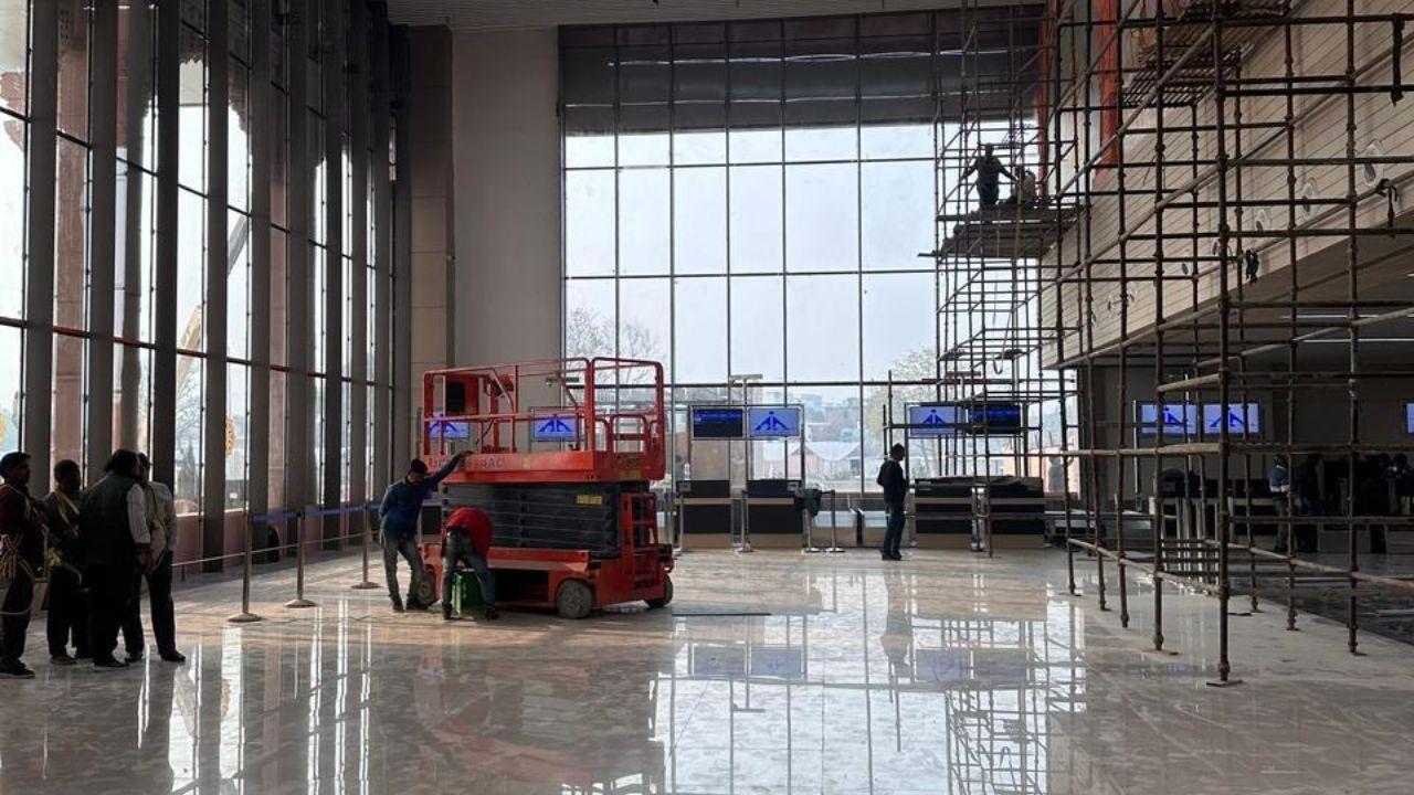 Workers raced to finalise civil work at the airport, adorning the terminal with tricolour-themed fabric, highlighting a patriotic touch for its imminent unveiling.