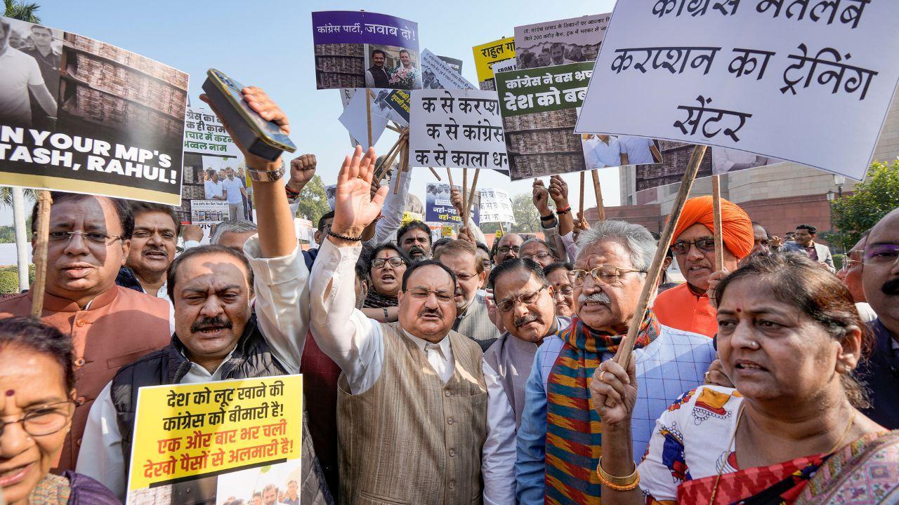 JP Nadda spearheaded a demonstration accusing the Congress of corruption, highlighting alleged malfeasance and questioning the origins of recovered cash at a Congress MP's premises. Pics/ Agencies