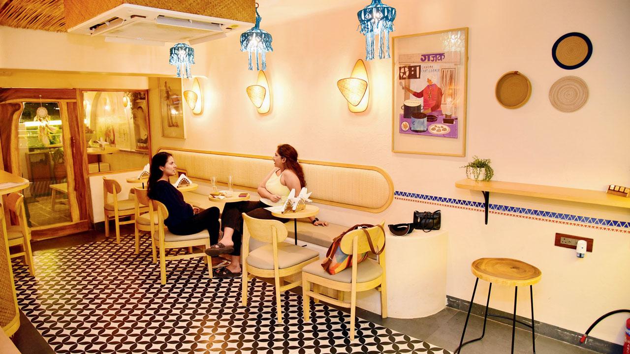 The eatery has warm and well-lit interiors with pops of colour and a pani puri cart near the entrance. Pics/Shadab Khan