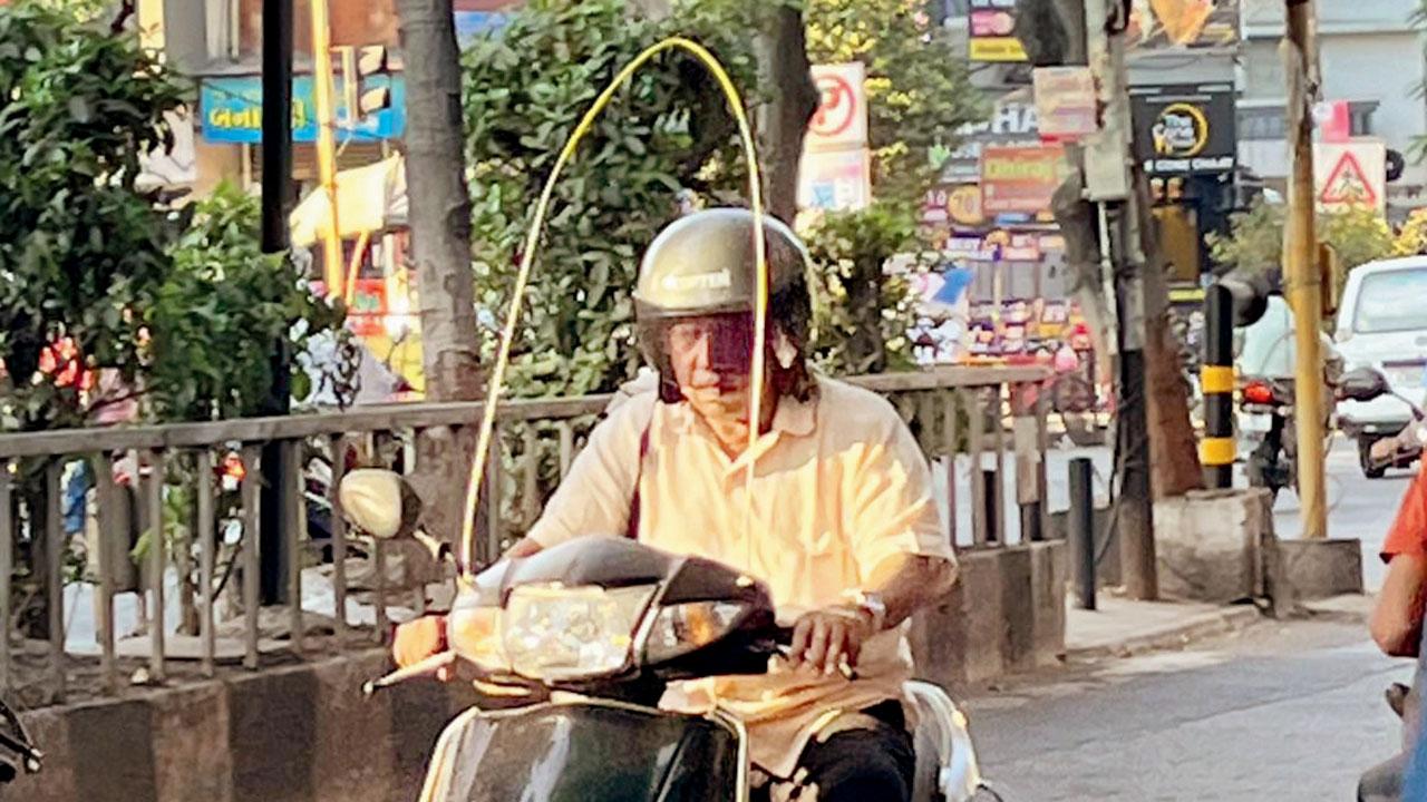 A biker in Surat seen with a protective frame attached to his bike