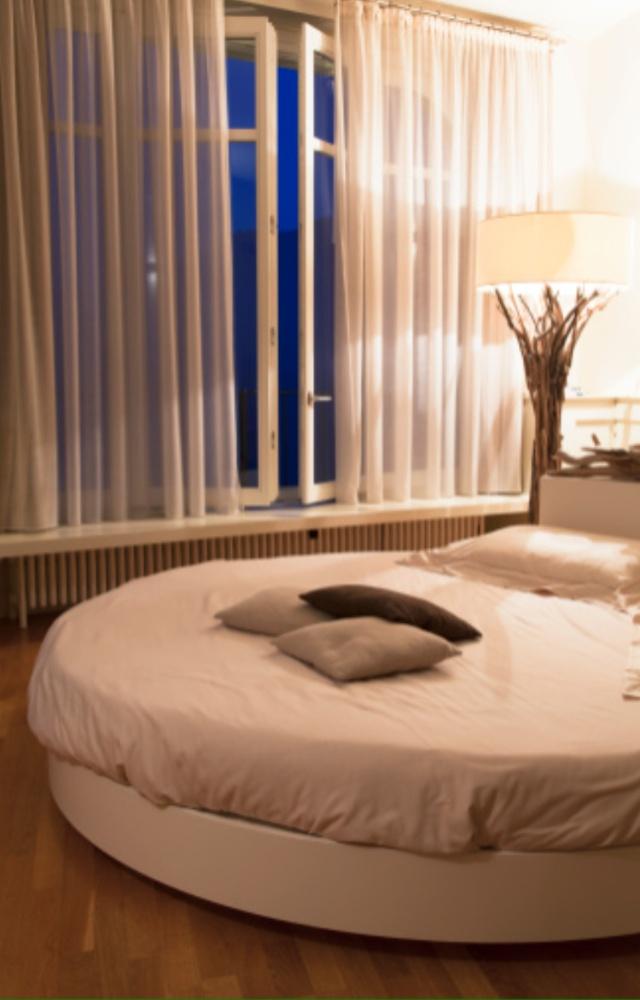 The right lighting can transform a room and set the mood for romance. To create a cosy and romantic atmosphere, opt for ambient lighting with dimmer controls
