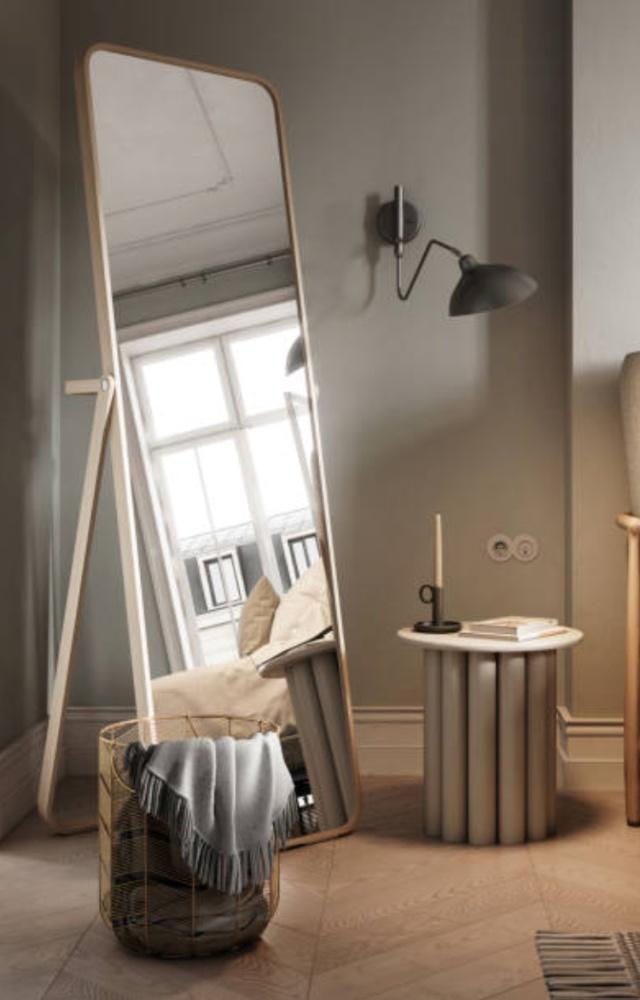 A full-length mirror serves more than just a practical purpose; it also improves the atmosphere of the bedroom by letting in light and space
