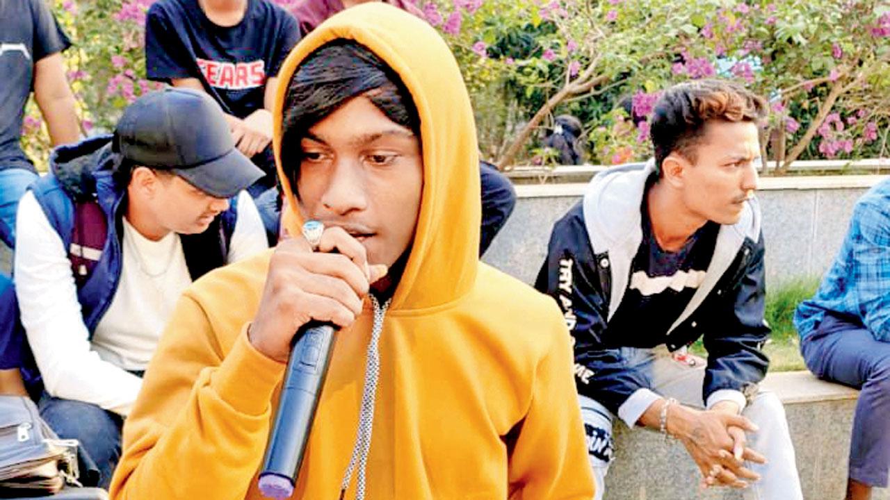 A boy raps at the cypher