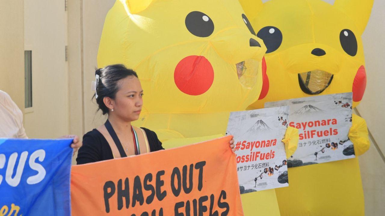 The protestors donned anime costumes to protest against the use of fossil fuels in the rare protests and held placards which read 'Sayonara Fossil Fuels'.