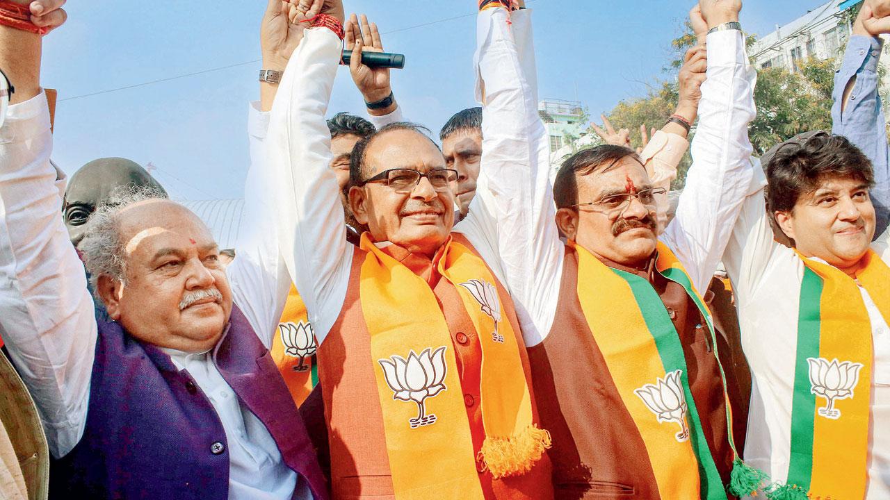 Madhya Pradesh Chief Minister Shivraj Singh Chouhan with BJP leaders celebrating the party’s win. Pic/PTI