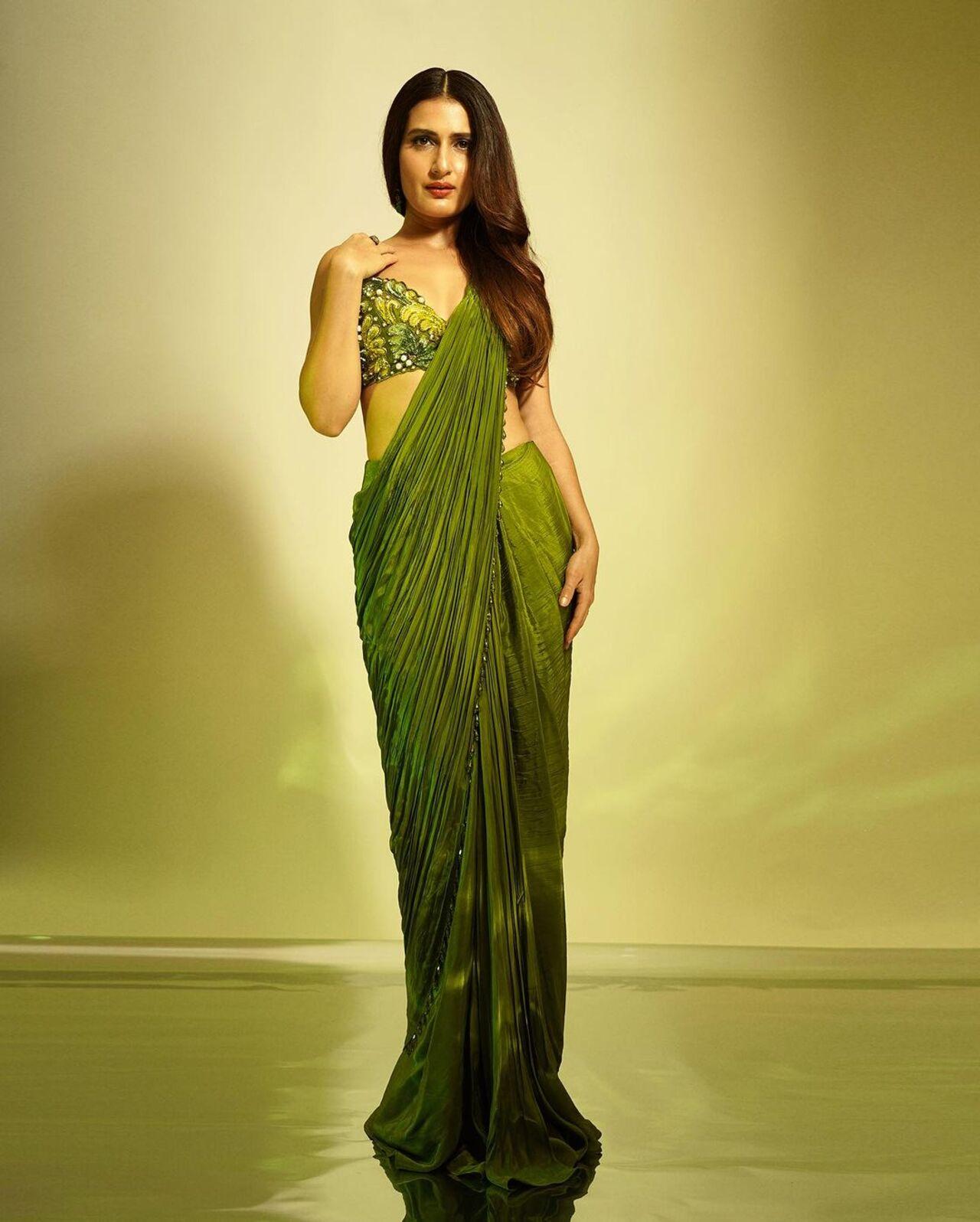 In this look, Fatima Sana Shaikh opted for a parrot green colour gown and paired it with a heavily embroidered gown