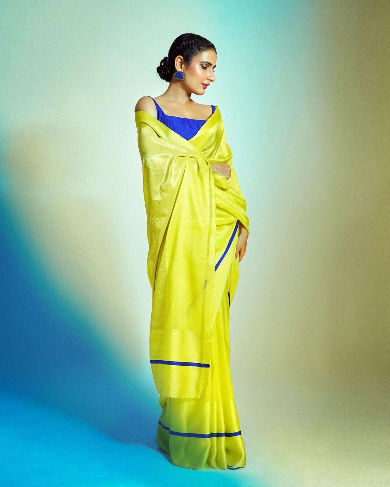 Fatima looked stunning in a neon green saree with a chic bun. She paired it with a blue blouse and matching earrings