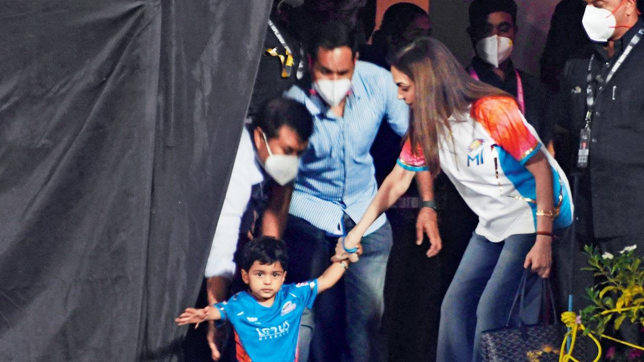 Nita Ambani stops her grandson from running on to the field during the match between Mumbai Indians and Delhi Capitals at the first women’s IPL T20 at Brabourne stadium. Pic/Ashish Raje