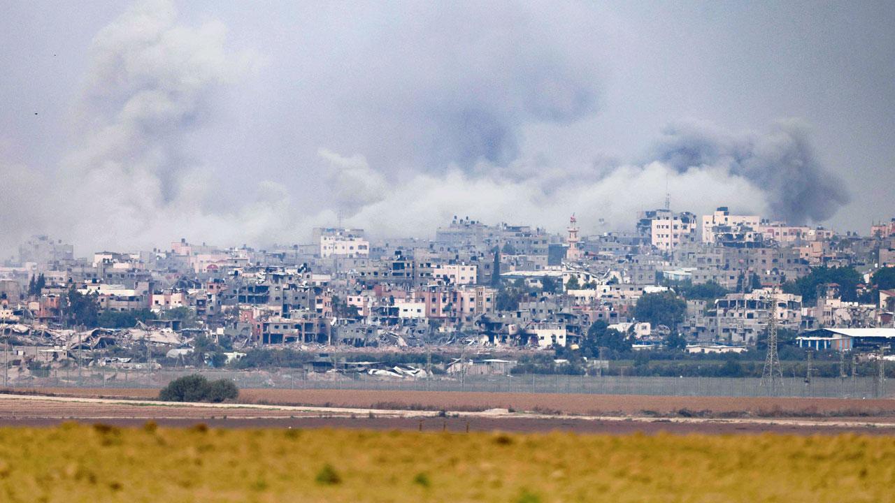 Smoke billows out of a bombarded area in Gaza. Pic/AFP