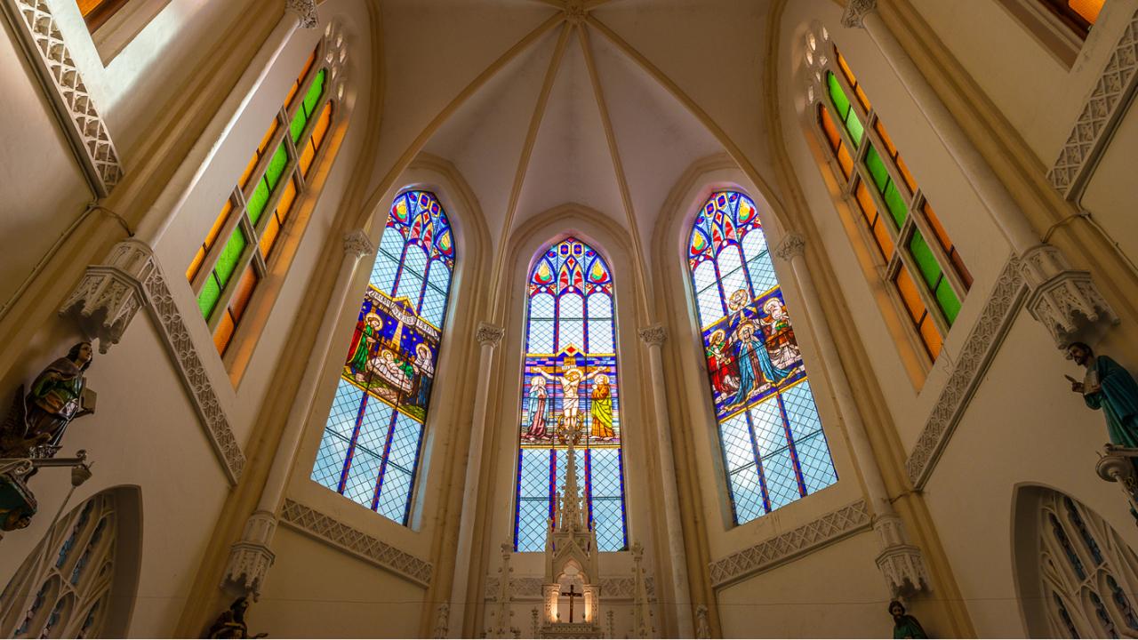 Our Lady of Glory Church, more popularly called Gloria Church, in Byculla boasts of stained glass and particularly the birth of Jesus in a different way. At Gloria Church, one of the main panels in the sanctuary is the nativity scene. Ainsley Lewis, who is one of the architects that helped restore it along with David Cardoz in 2019, says they got all these glasses and the panel restored. It is a beautiful kind of panel, which is there, with painted glass. The artists actually paint onto the glass and fire it so that the paint gets embedded into it. 