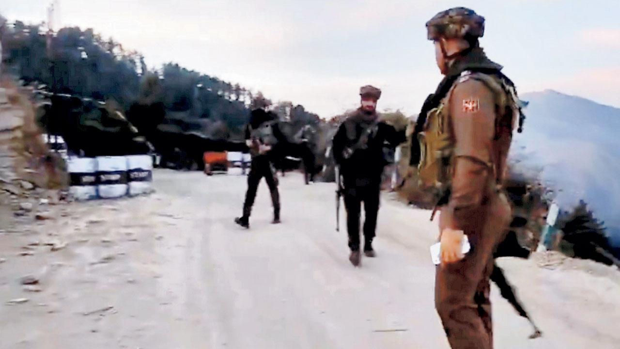 Army personnel stand guard near the site. Pic/PTI