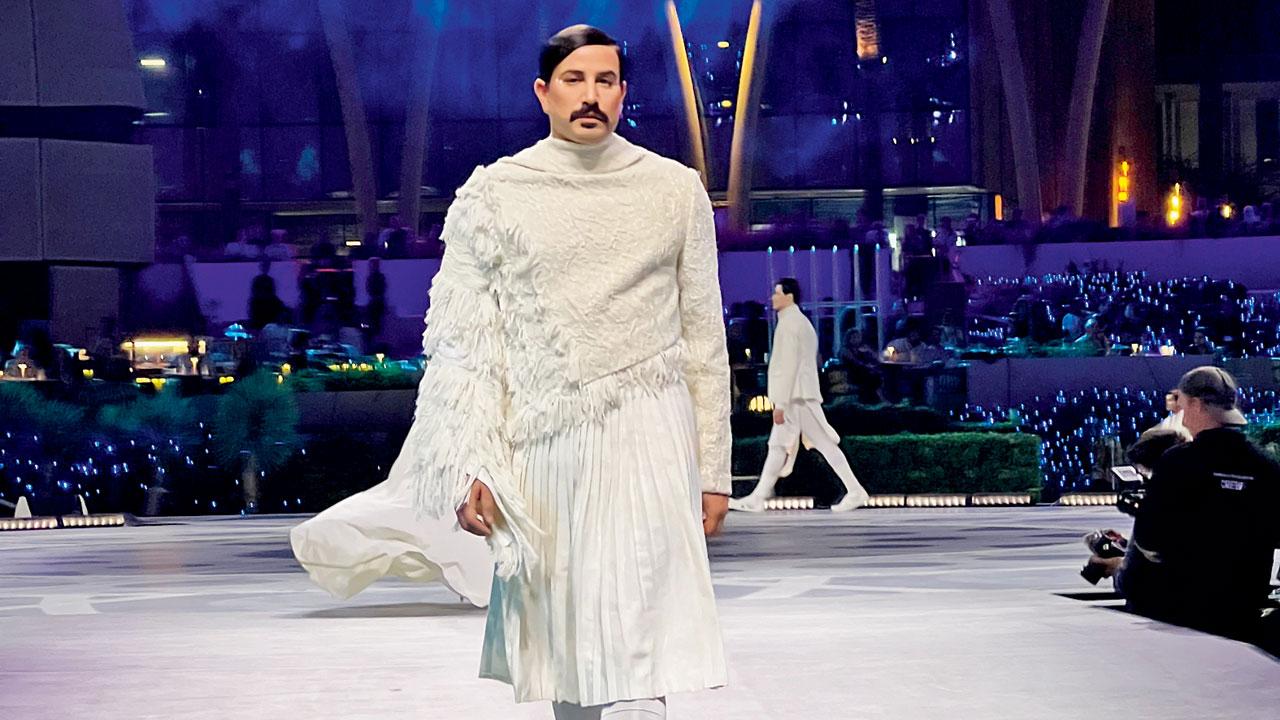 A model walks in an outfit from the Indra collection; 