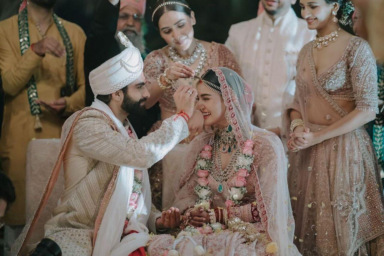 One picture shows Kunal applying the pious sindoor and doing some wedding rituals