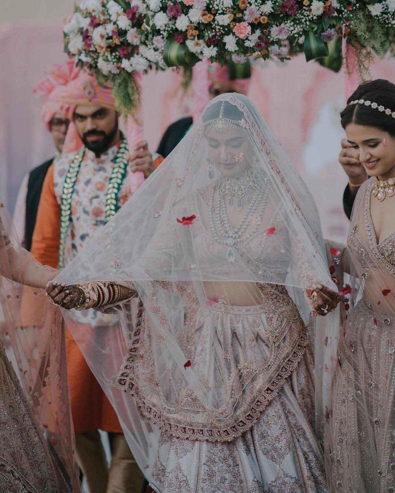 Mukti wore a stunning, heavily embroidered pink and white dress, and her lehenga had a touch of red at the bottom