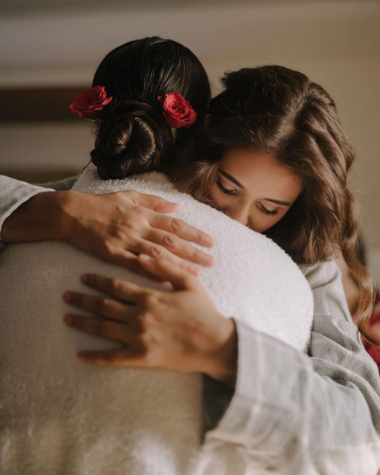 This picture has Shakti and Mukti sharing a hug