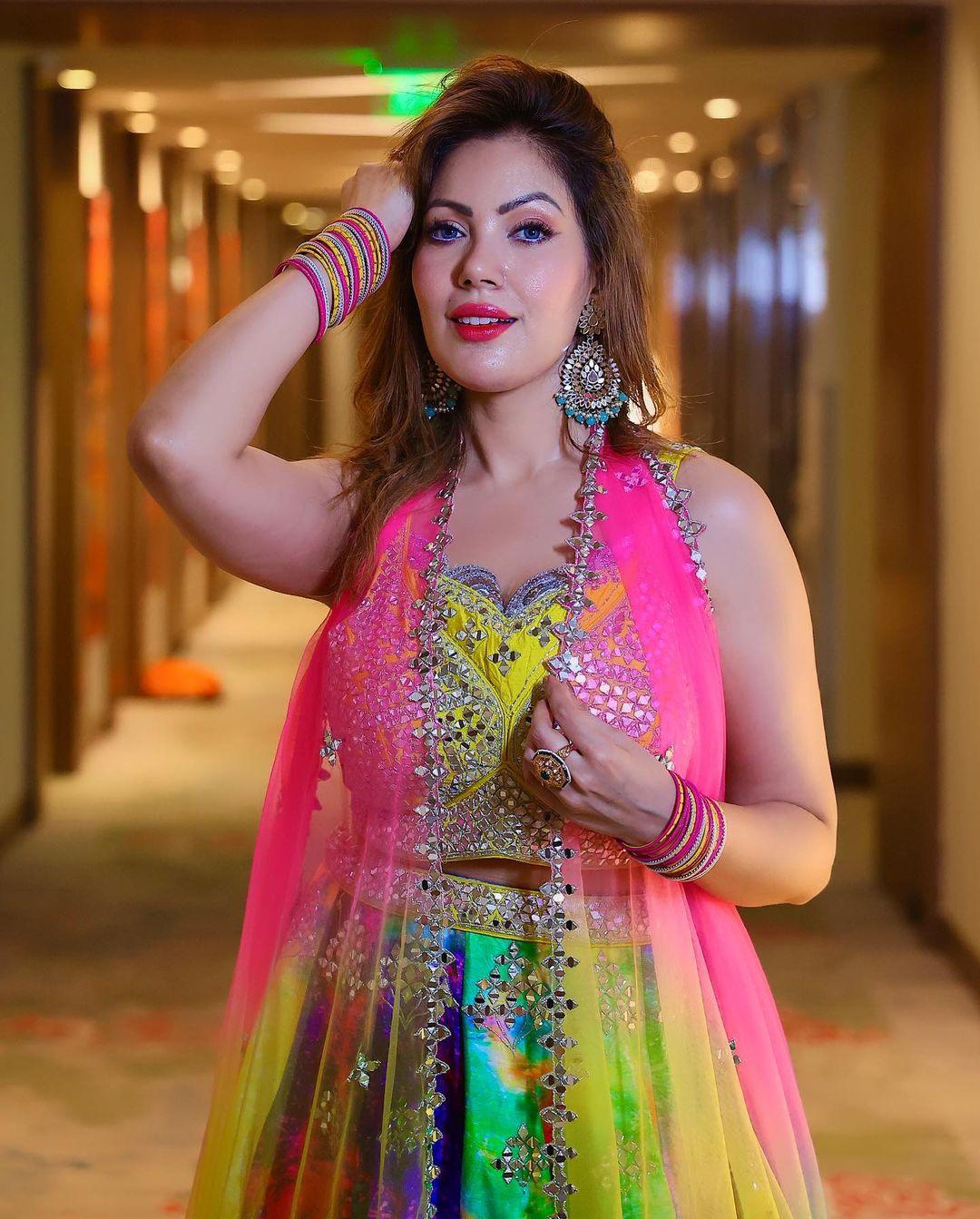 A net dupatta bordered with golden lace is the cherry on the cake for this look. Whether it's a carnival-themed wedding party or a mehendi function, worry not – this multicolored lehenga is all you need!