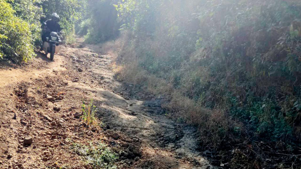 A two-wheeler struggles to make its way from Karambeli hamlet which has a population of over 1,000 tribal people and is located 5.5 km from the main road in Khalapaur taluka