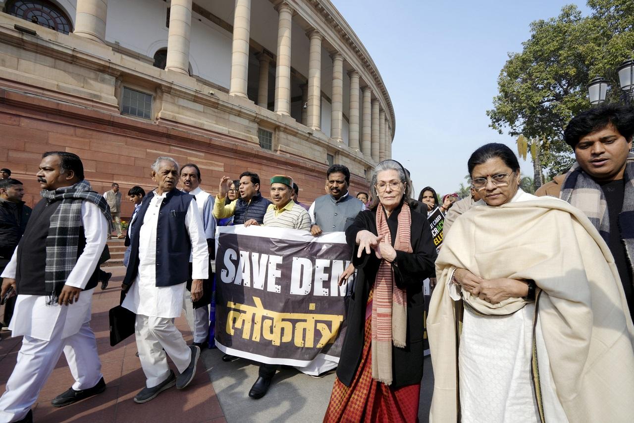 While protesting the opposition MPs were carrying banners of of 'save democracy'