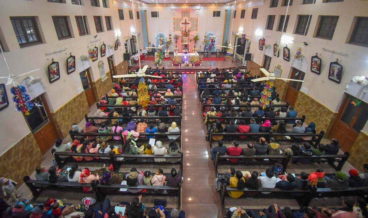 People burst crackers, and took part in midnight mass prayers being held at a church in Chhatarpur, Madhya Pradesh on the occasion of Christmas