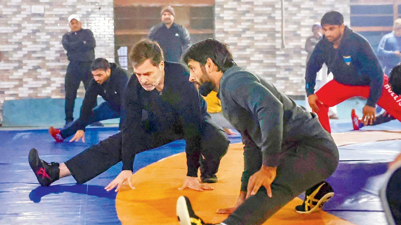 Rahul Gandhi wrestles with Punia