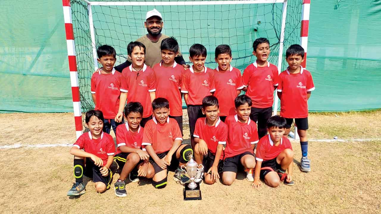 Sanjeevani World School’s boys U-8 team with their handball trophy