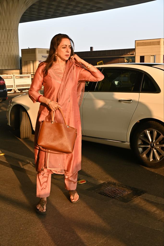 Hema Malini looked stunning in the orange suit as she was photographed in the city