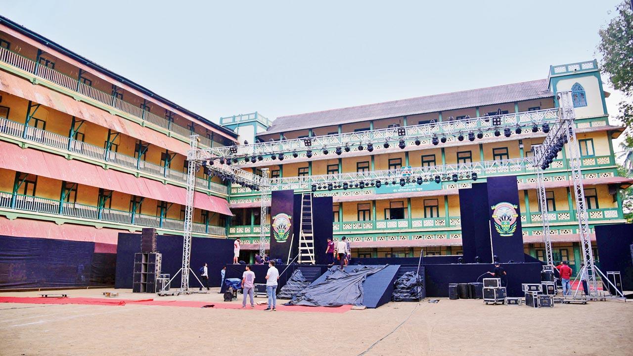 The stage being set up in the foreground of the school