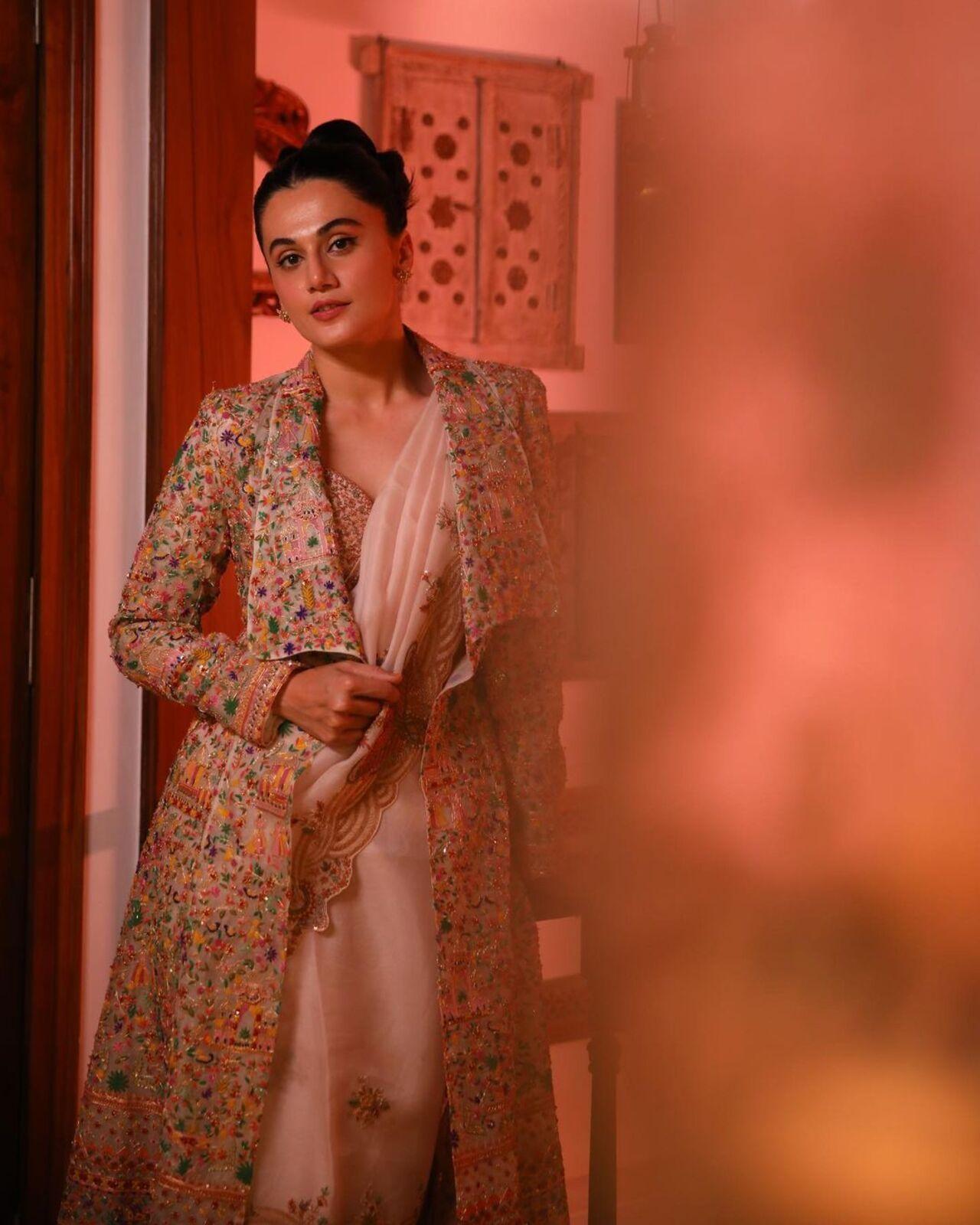 It's not easy to experiment with a saree without making a mistake, but Taapsee knows how to pull it off. She paired a peach saree with a decorated blazer