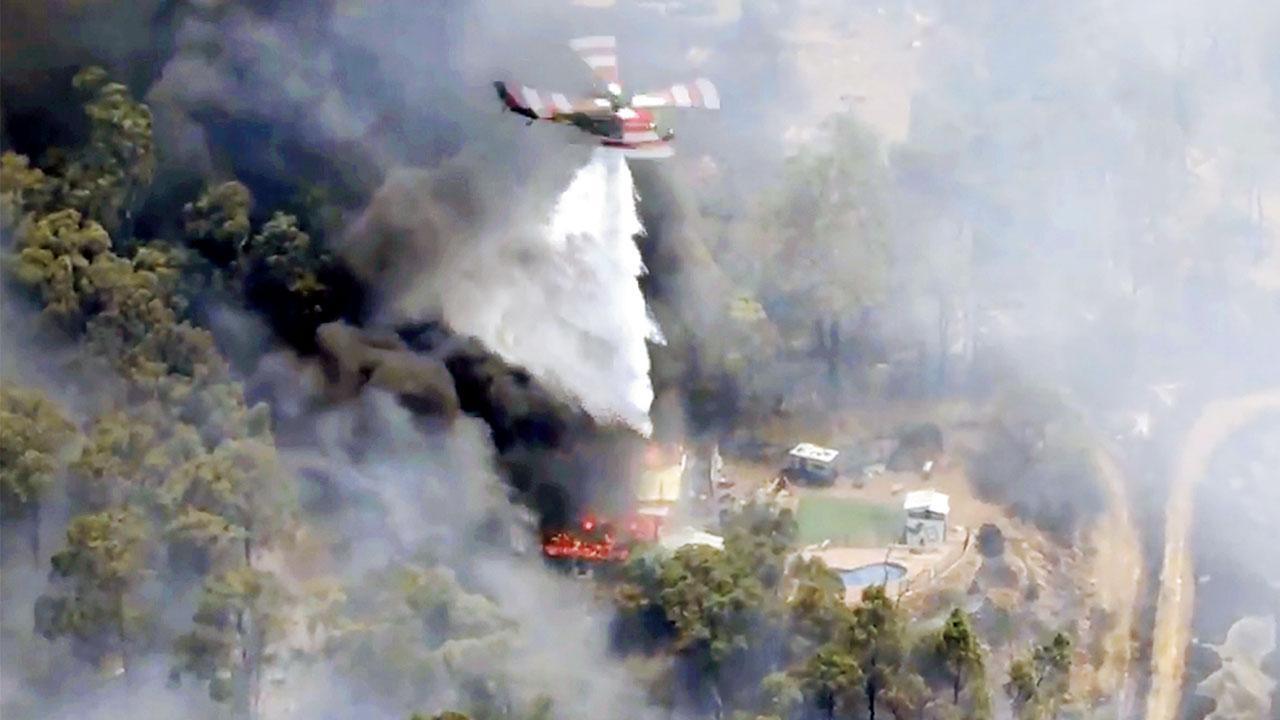 Out of control wildfire destroys homes near Perth