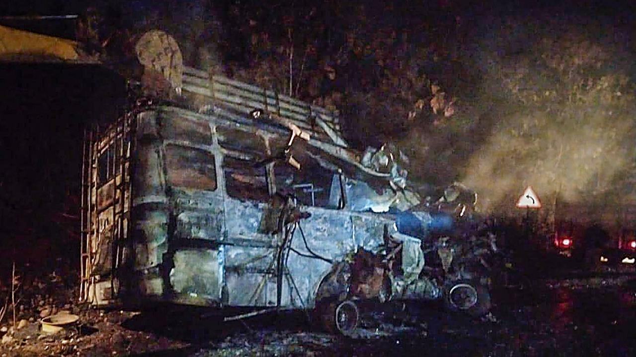 Charred remains of a bus that caught fire after colliding with a dumper in Guna district of MP. Pics/PTI (videograbs)