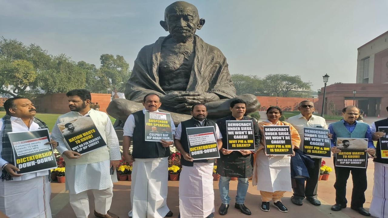 Opposition INDIA alliance leaders staged a protest near the Gandhi statue in the Parliament complex on Friday, a day after 14 MPs were suspended
