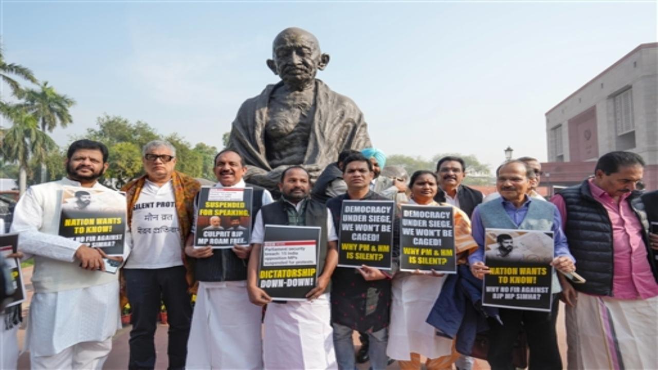 Opposition INDIA alliance leaders staged a protest near the Gandhi statue in the Parliament complex on Friday, a day after 14 MPs were suspended.