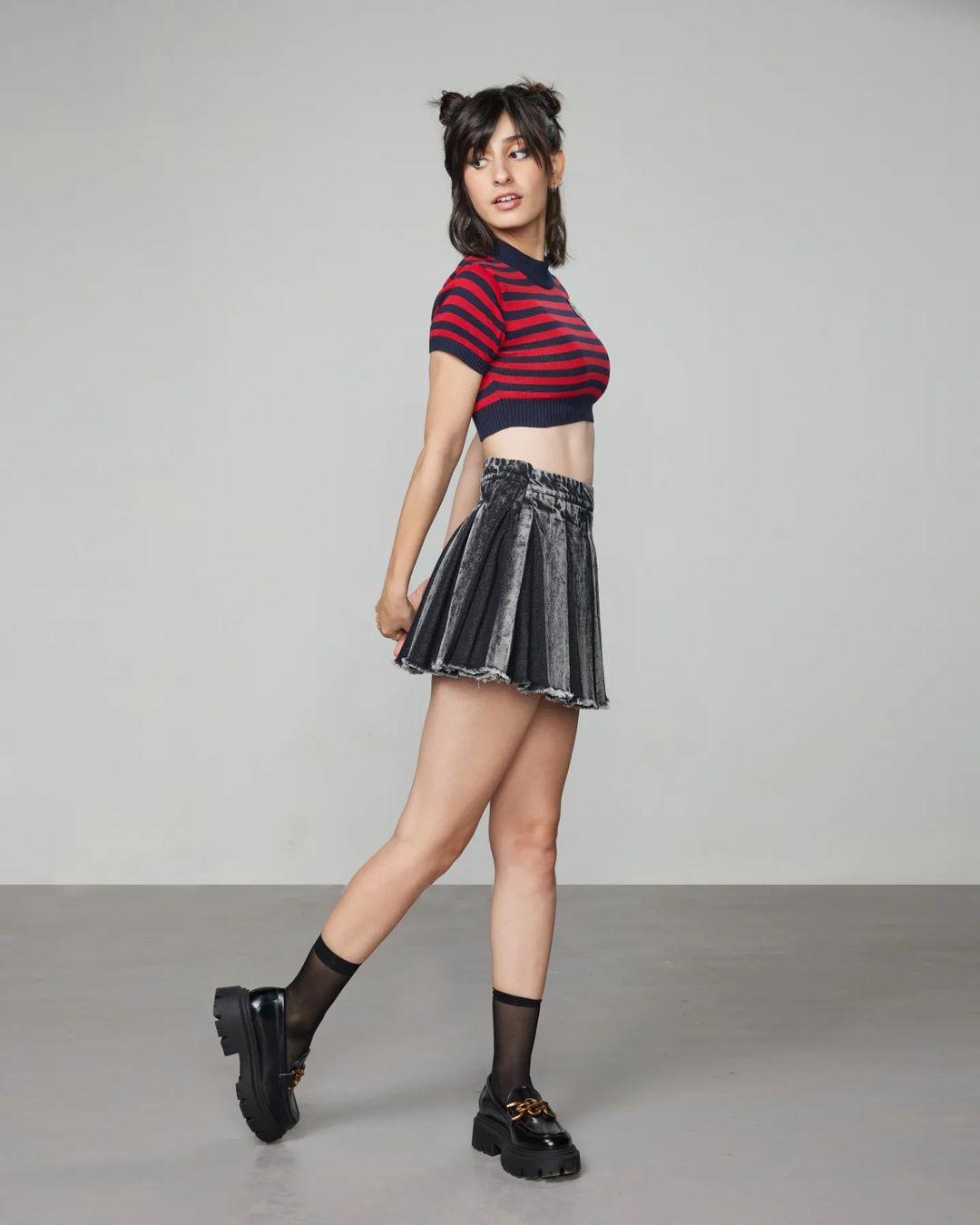 To add a touch of edge to your Christmas outfit, take inspiration from Dot's effortless look. The singer and actress combined a denim skirt with a red-striped top which had a jaw-dropping effect.