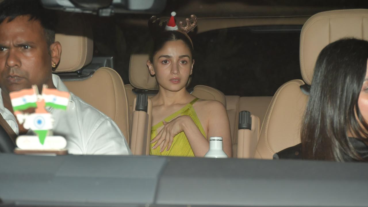 Alia Bhatt was dressed to match the theme. She opted for a lime green outfit with a very Christmas-y headgear