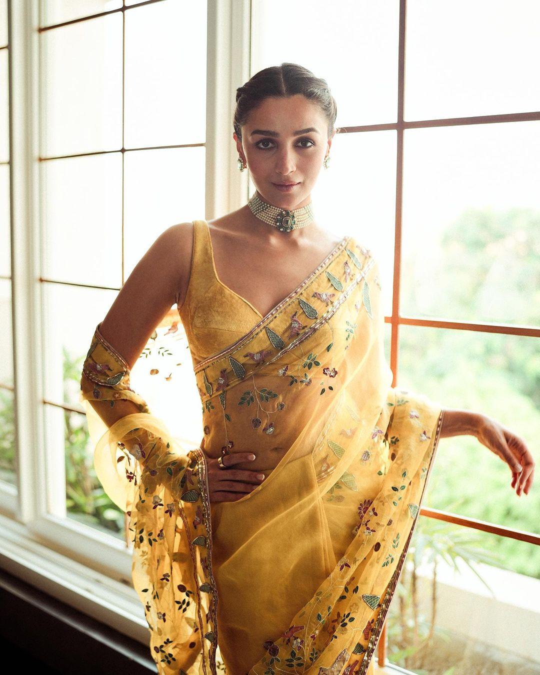 Alia Bhatt wore a resplendent yellow saree to a wedding recently