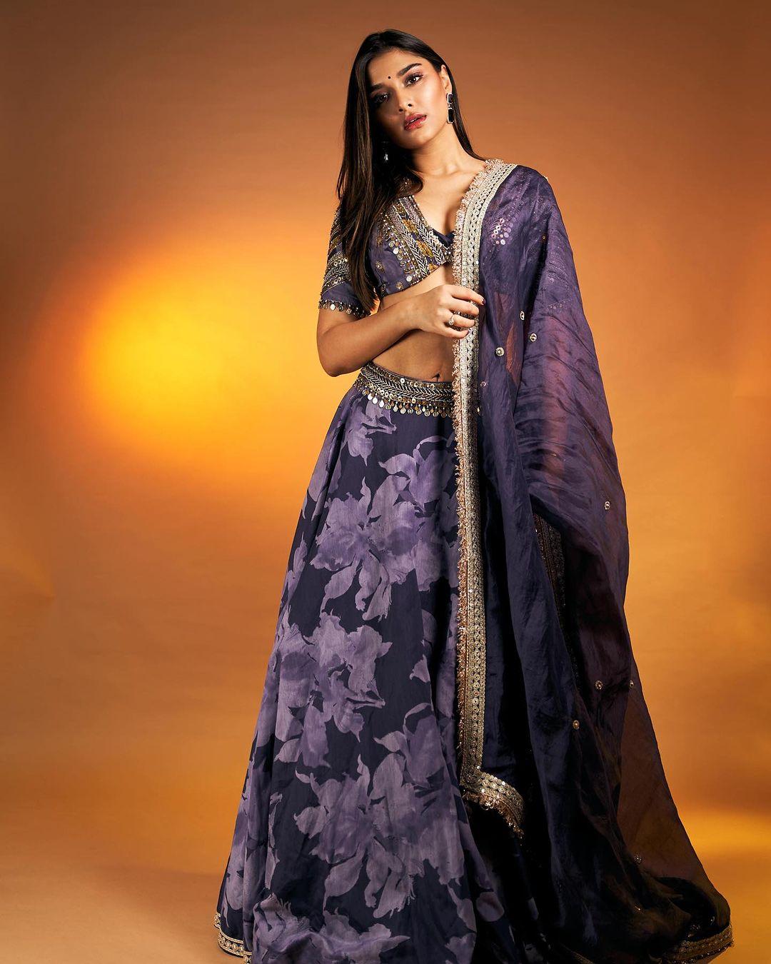 Saiee look is serving desi vibes in a purple lehenga with a contrasting blouse adorned with intricate embroidery. Her look strikes a perfect balance between regality and contemporary chic