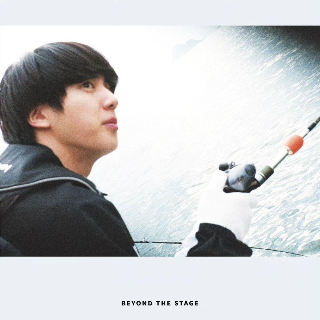 This candid captures singer Kim Seokjin doing what he loves the most during his free time - fishing!