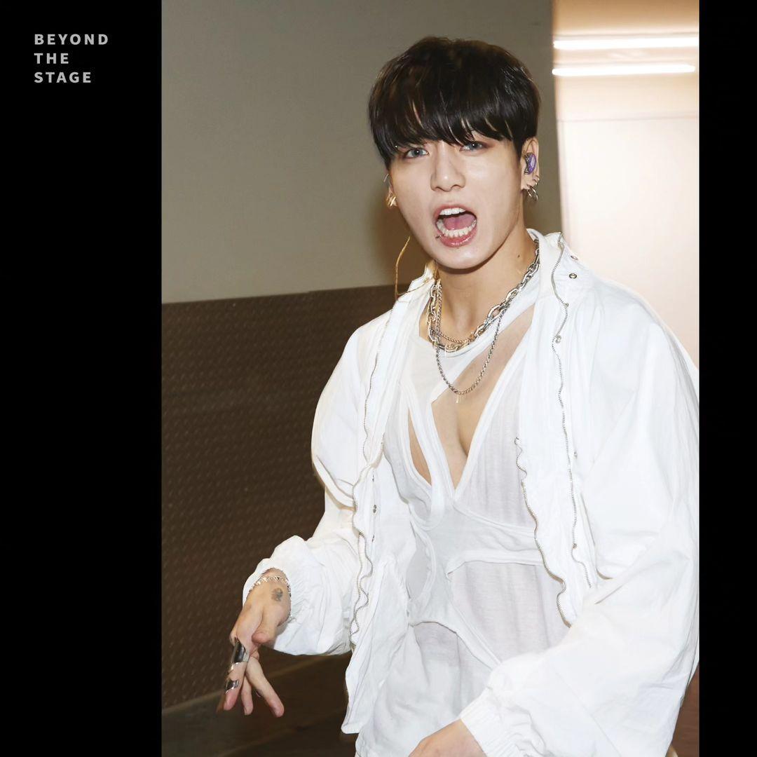 The 600-page documentary photobook features images of 'BTS in their natural habitat', including shots from their everyday life. Jungkook here is seen just off the stage amid their Permission to Dance concerts