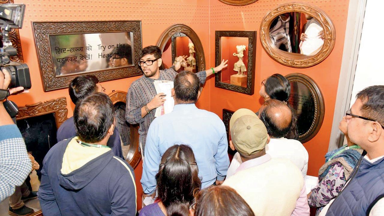 Siddhant Shah (centre) guides visitors through the exhibition