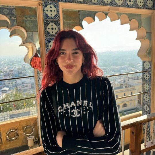 In this picture, Dua is standing atop one of the many palaces in the state
