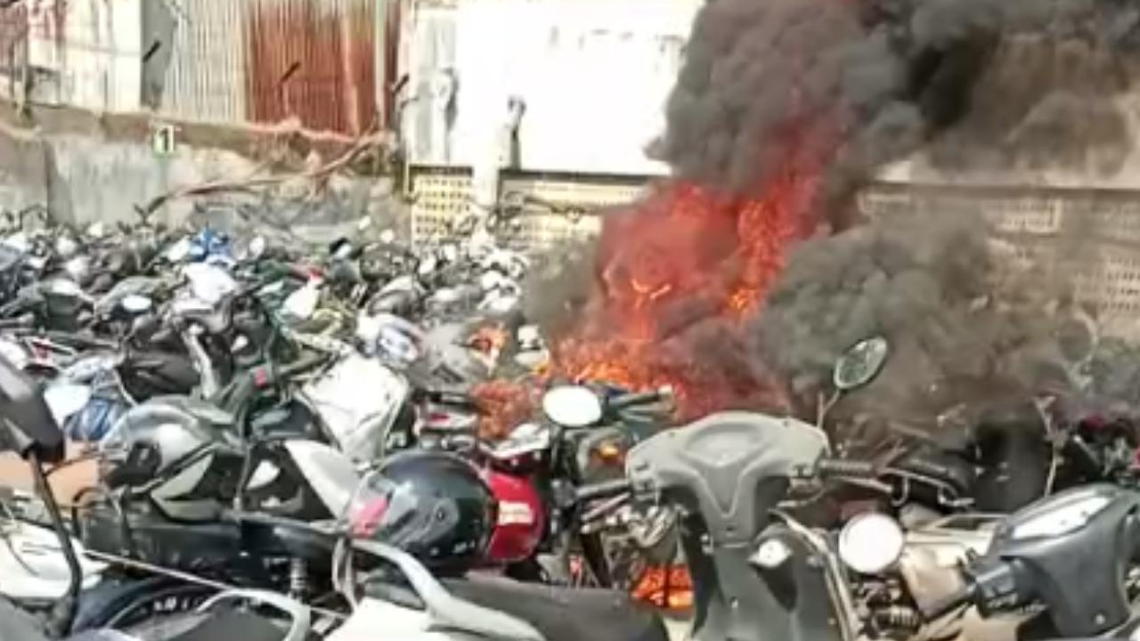 The fire was limited to open parking space which housed as many as 25 to 30 two-wheelers, the officials said