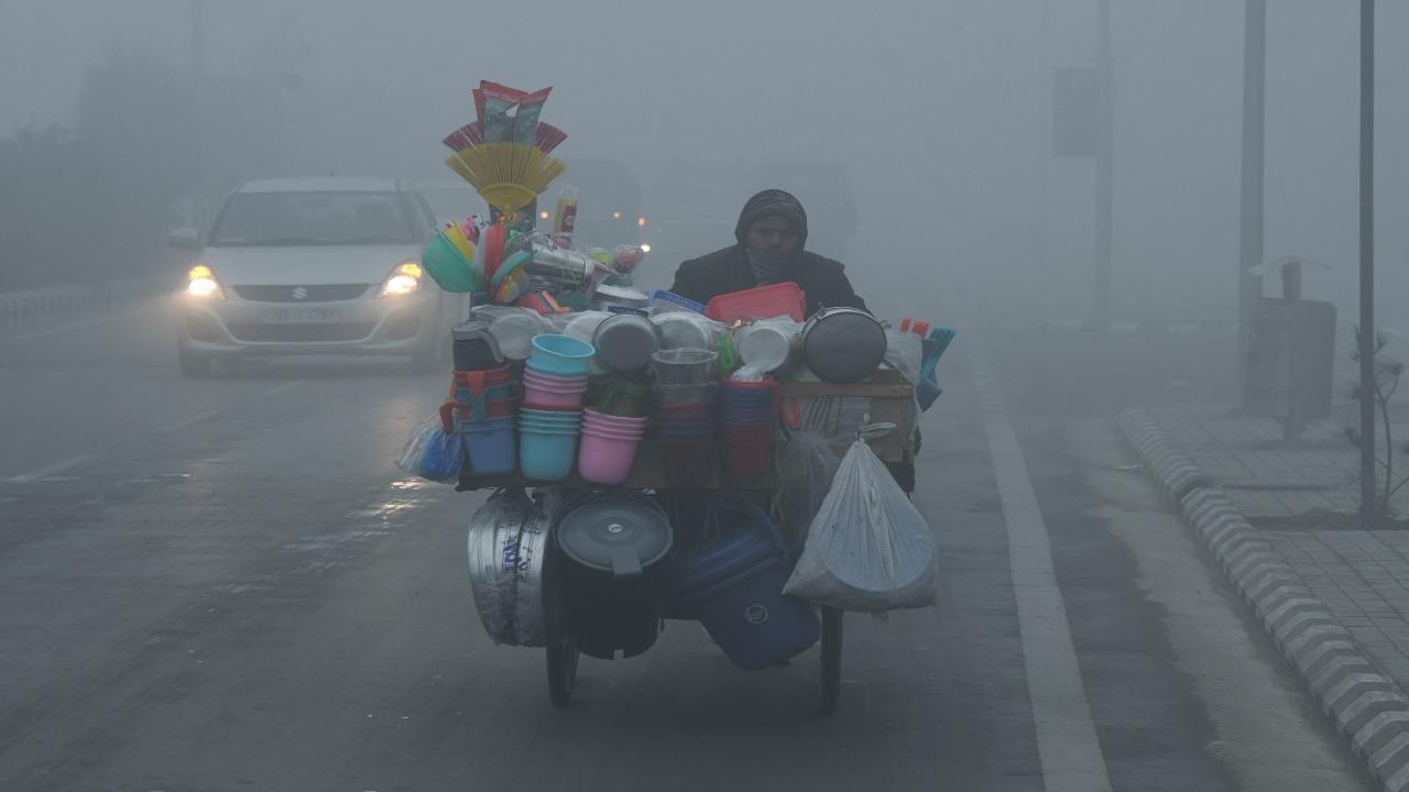 A thick layer of fog enveloped Srinagar city, causing disruptions to normal life for the second day in a row. Reduced visibility led to lighter traffic on roads in the morning, with vehicles moving cautiously due to the foggy conditions.