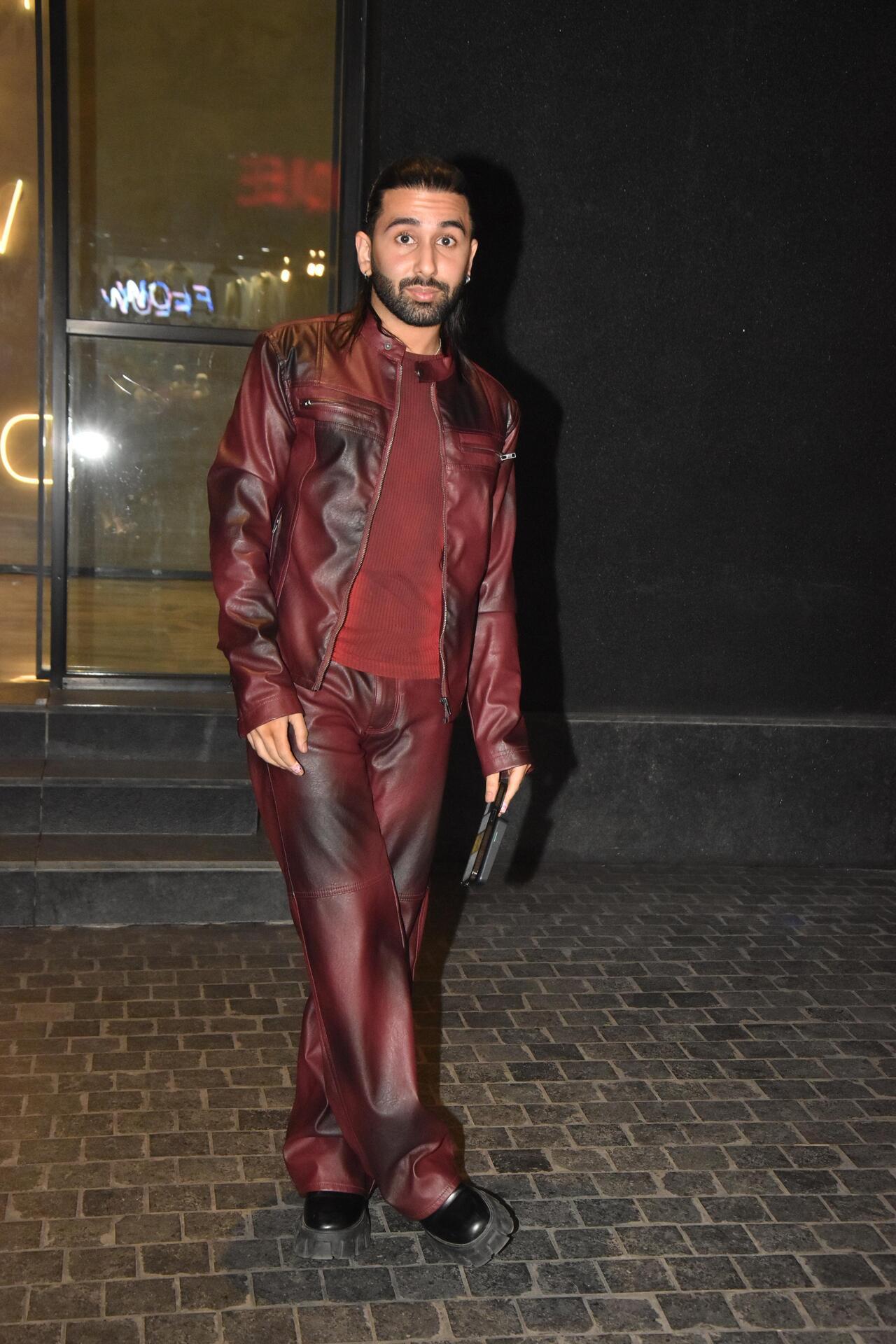 Social media sensation Orry was seen in a maroon suit for the screening