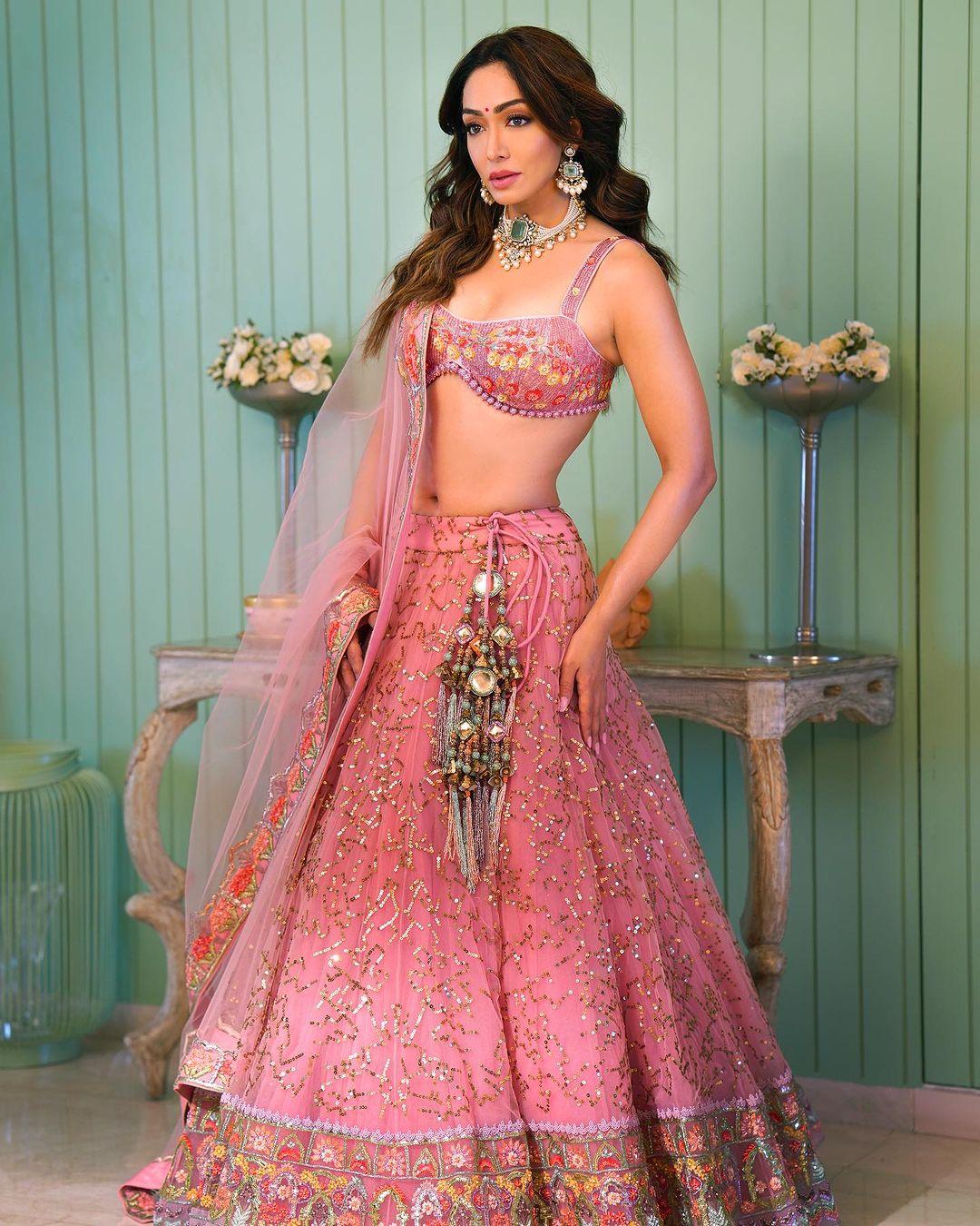 If you're in your Barbie era, this pink lehenga is perfect for you. Khushali shared beautiful pictures showcasing this stunning and grand outfit.