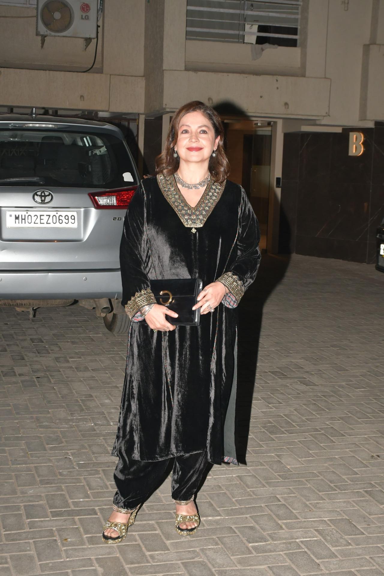 Pooja Bhatt arrives for the dinner party at father Mahesh Bhatt's house in a black velvet dress